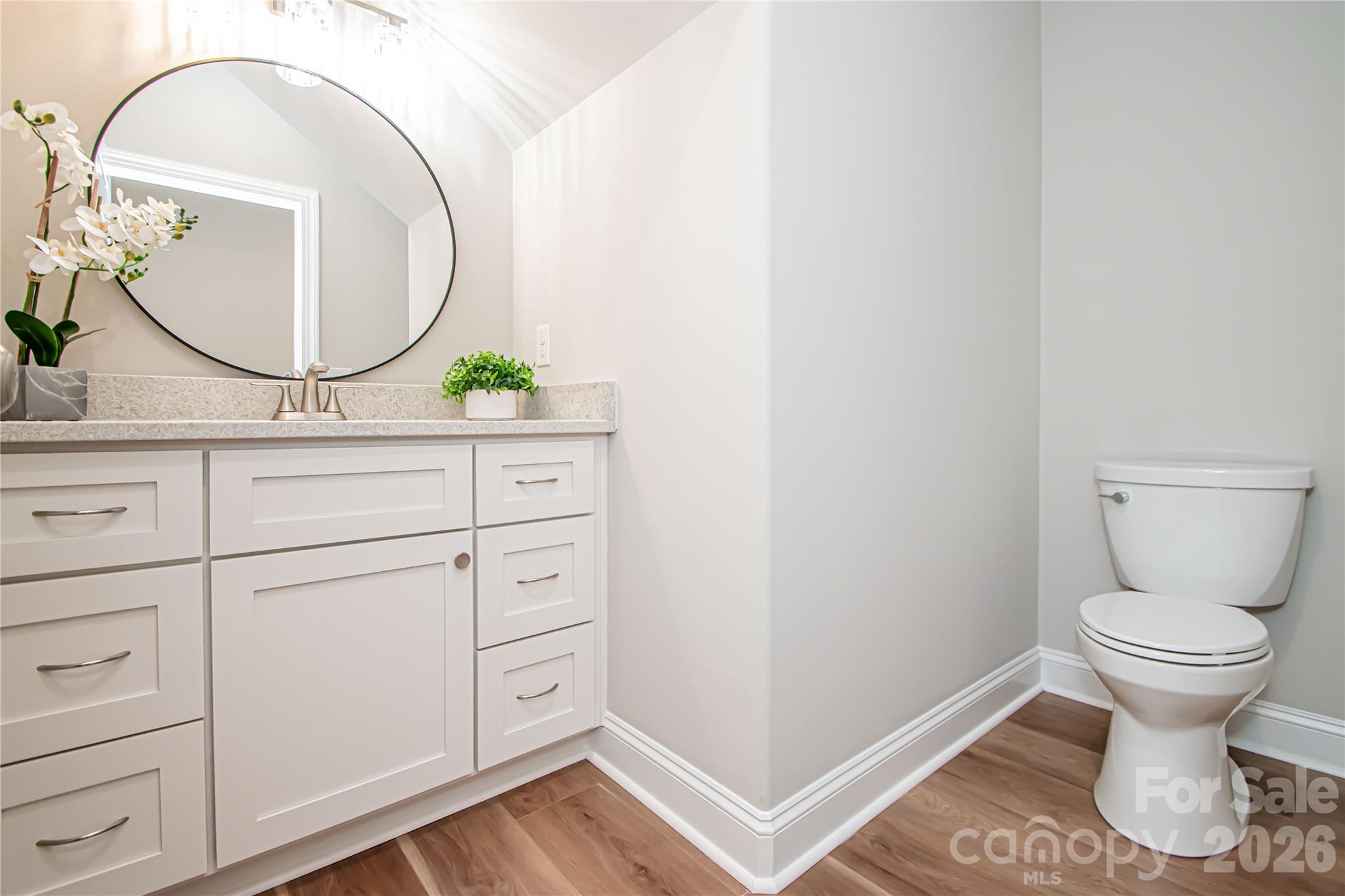 1508 Marion Street Monroe, NC 28112 - Photo 40 of 48 a bathroom with a toilet sink and mirror