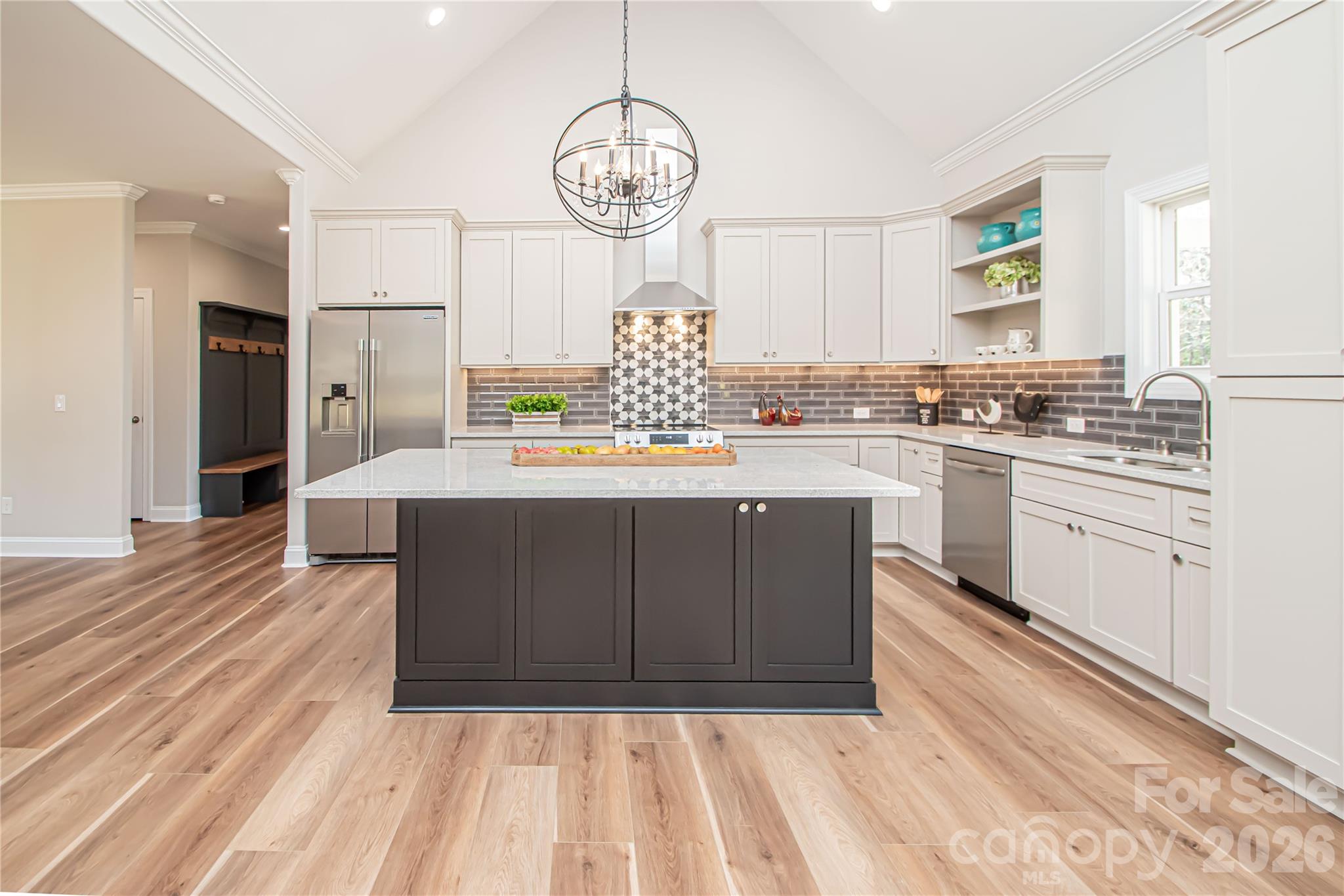 1508 Marion Street Monroe, NC 28112 - Photo 5 of 48 a large kitchen with stainless steel appliances granite countertop a stove a sink dishwasher and a refrigerator with wooden floor