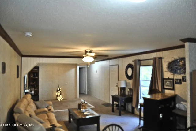 a kitchen with a dining table chairs and refrigerator