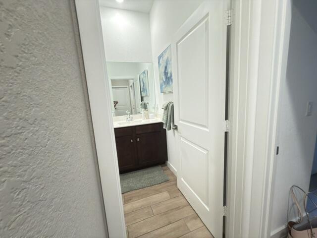 19696 Weathervane Way Loxahatchee, FL 33470 - Photo 27 of 39 a view of a bathroom from the hallway