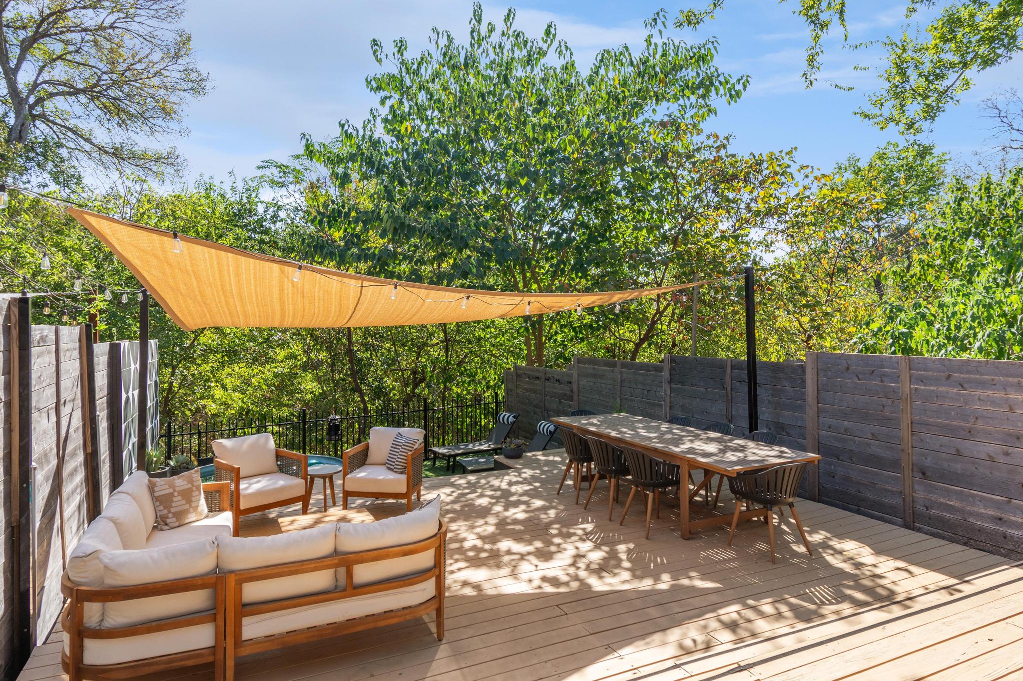 1177 Pandora Street, Unit B Austin, TX 78702 - Photo 1 of 30 Deck with outdoor lounge area and a fenced backyard