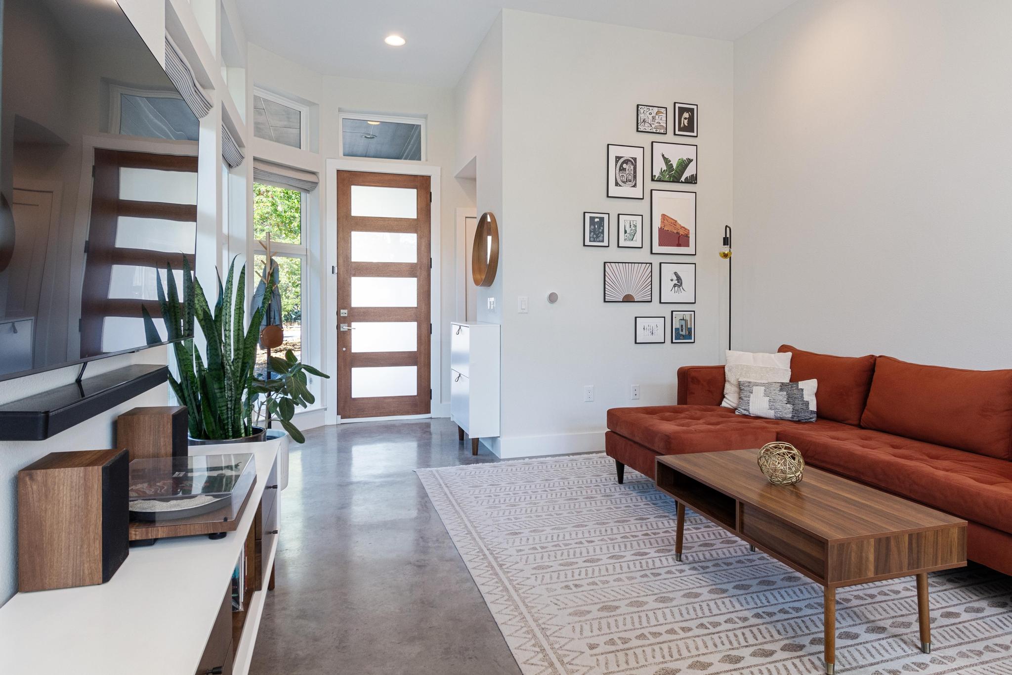 1177 Pandora Street, Unit B Austin, TX 78702 - Photo 11 of 30 Living room featuring finished concrete floors and recessed lighting