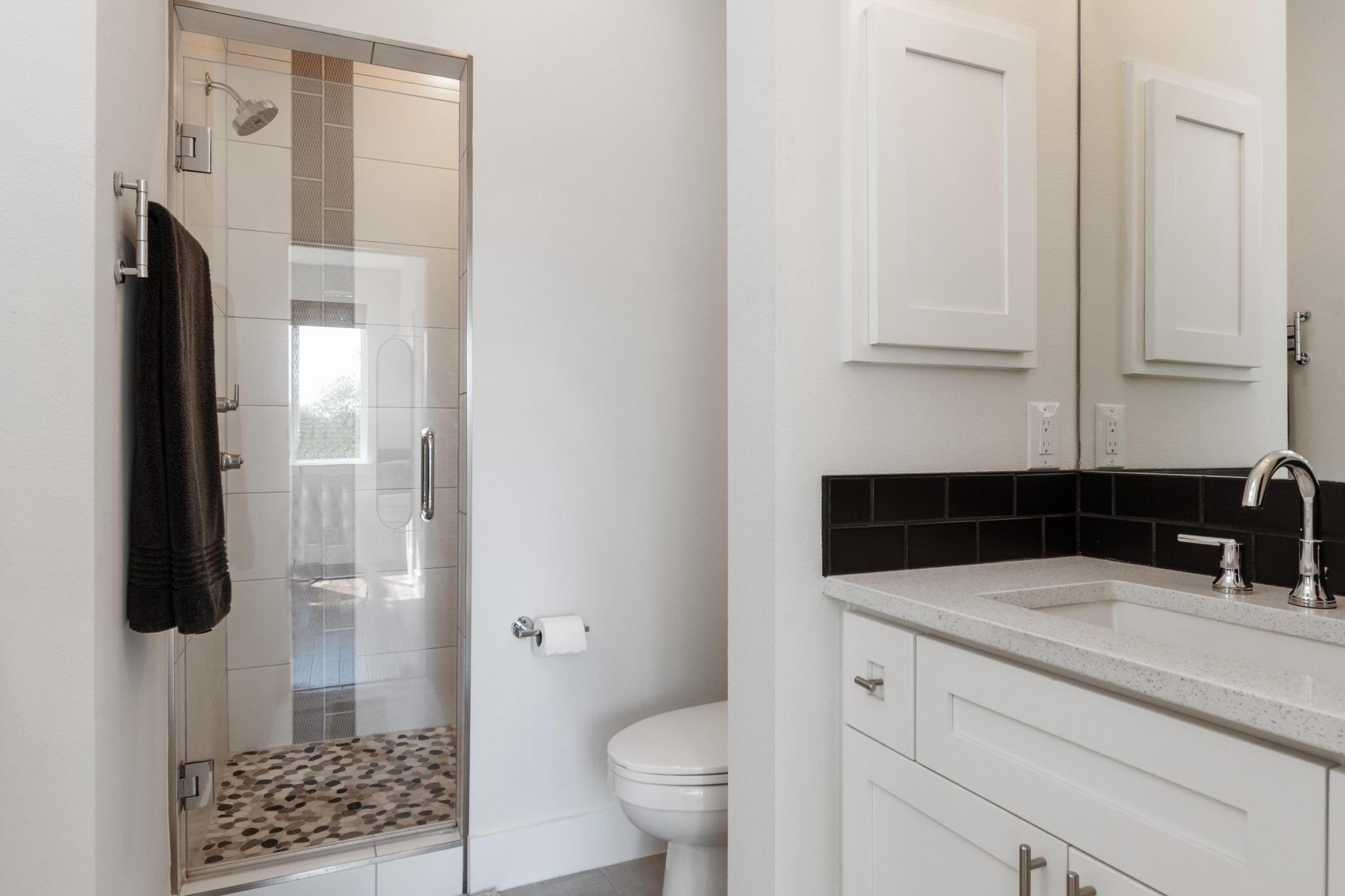1177 Pandora Street, Unit B Austin, TX 78702 - Photo 17 of 30 Full bathroom featuring a shower stall and vanity