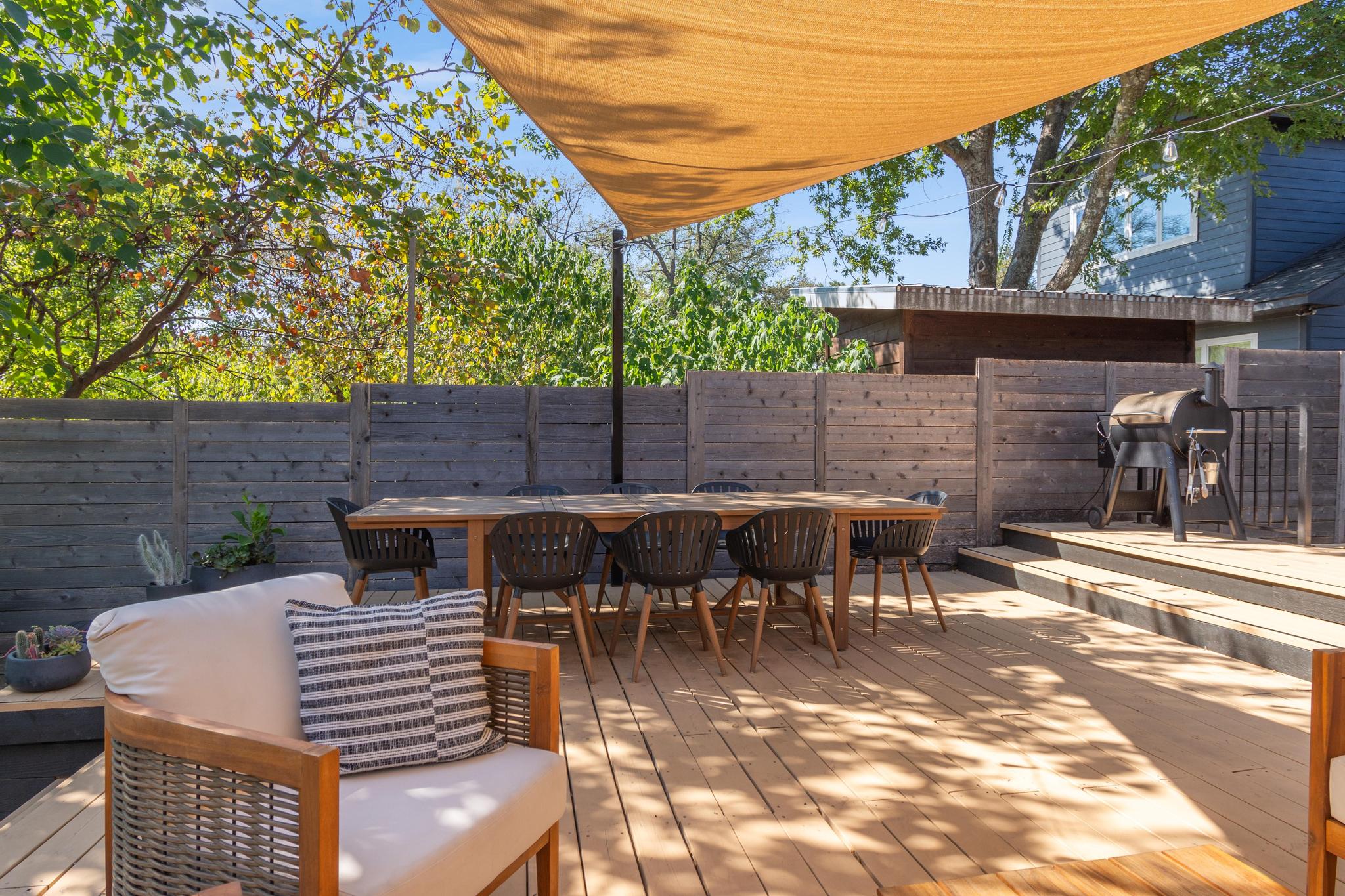1177 Pandora Street, Unit B Austin, TX 78702 - Photo 24 of 30 Wooden terrace featuring a fenced backyard, a grill, and outdoor dining area