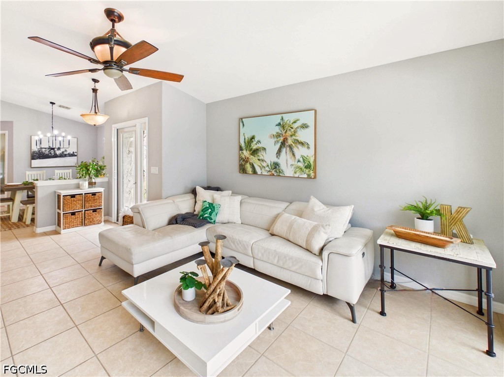 19694 Villa Rosa Loop Estero, FL 33967 - Photo 4 of 28 a living room with furniture and a chandelier
