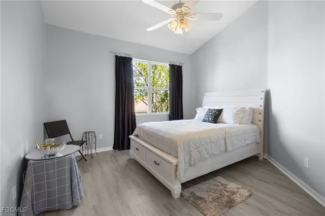 a bedroom with bed and window