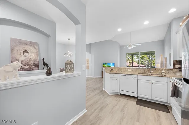 a kitchen with sink and window