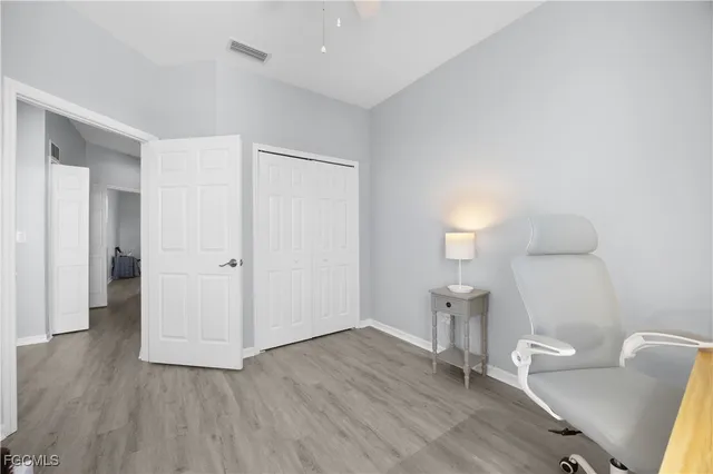 a view of an empty room and wooden floor