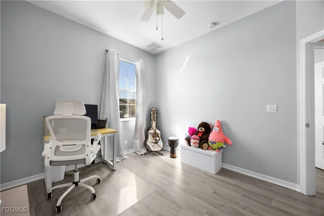 a view of a workspace with furniture and toys