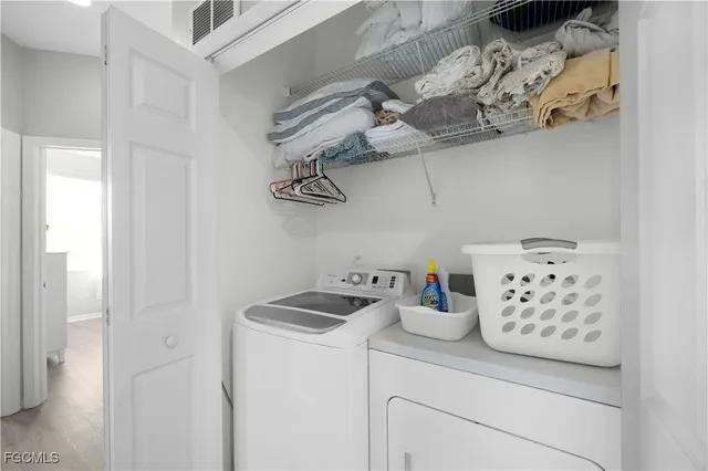 a kitchen with a refrigerator and a stove