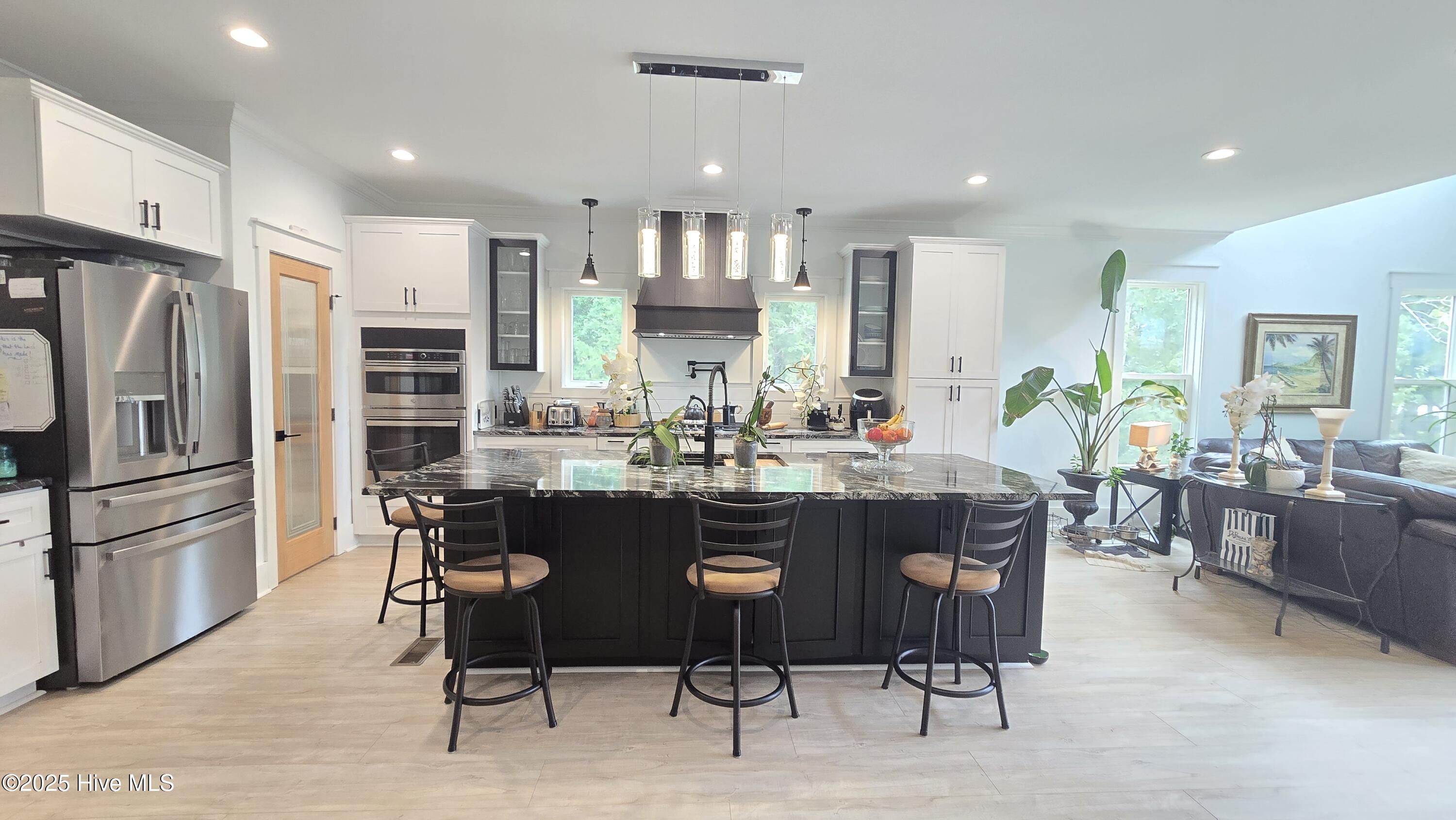 2659 Seashore Road Southwest Supply, NC 28462 - Photo 13 of 77 CHEFS KITCHEN WITH POT FILLER/WALK IN PANTRY/ AND ISLAND THAT SEATS 6 COMFORTABLY WITH ROOM FOR DINING TABLE TO SEAT 12 or have 2 tables and serve 20 no problem. Want to seat more open your sliders and put large tables on the deck:)