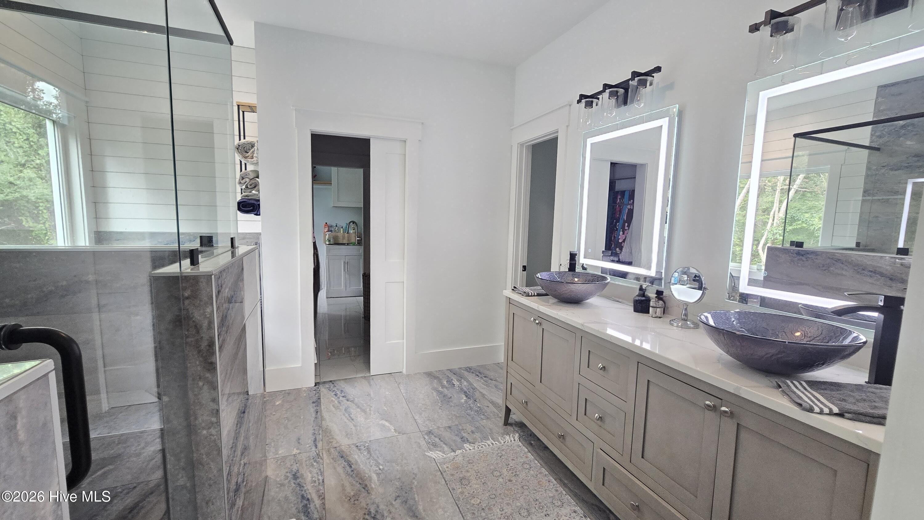 2659 Seashore Road Southwest Supply, NC 28462 - Photo 22 of 77 Pocket Doors to Her closet and access to laundry