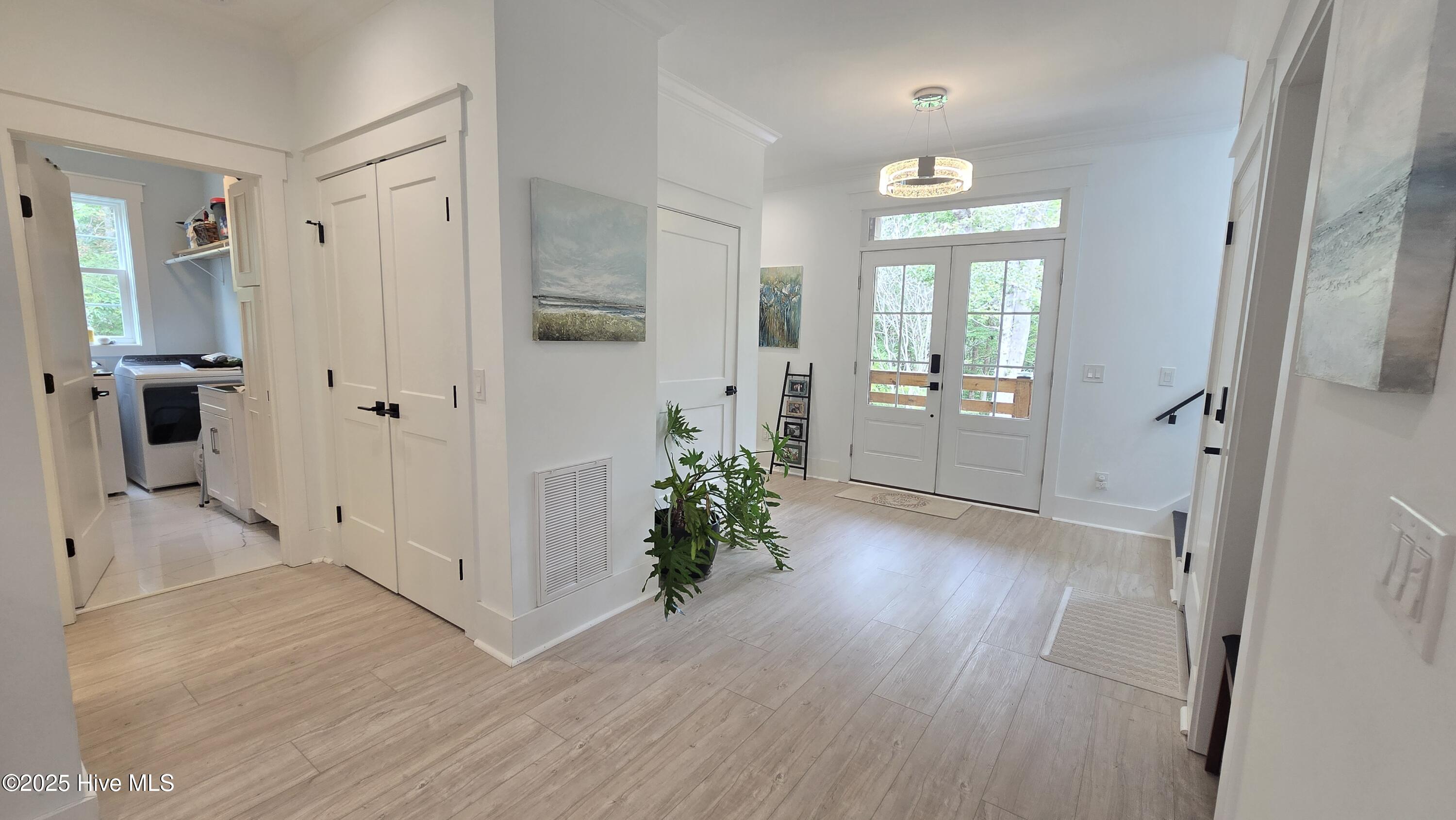 2659 Seashore Road Southwest Supply, NC 28462 - Photo 7 of 77 Huge Foyer with Center interior stairwell, coat closet and wired railed elevator shaft inspected and available for future. Just order your cab from Port City Elevators or equivilant.