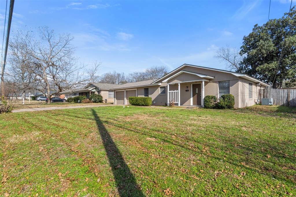 3126 Colgate Avenue Tyler, TX 75701 - Photo 33 of 33 a front view of a house with a garden