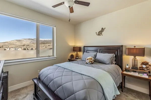 a bedroom with a bed and window