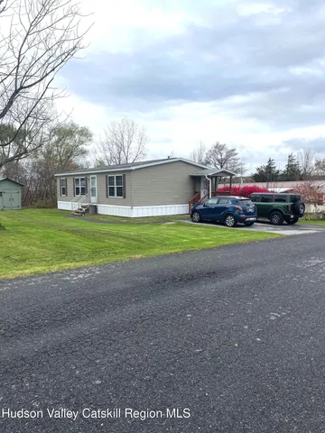 a view of an house with outdoor space and street view