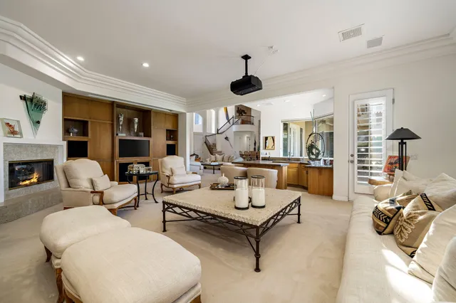a kitchen with stainless steel appliances granite countertop a sink and a refrigerator