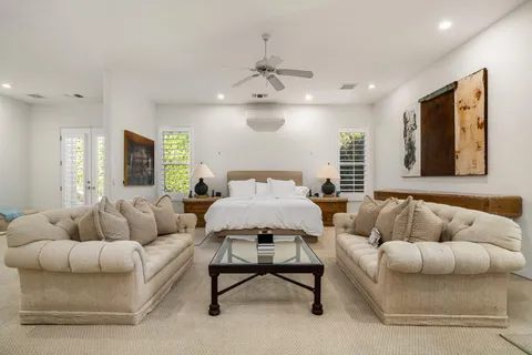 a spacious bathroom with a bathtub and shower