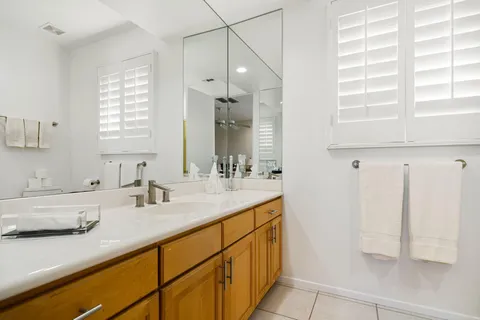 a view of an outdoor dining space with a table and chairs