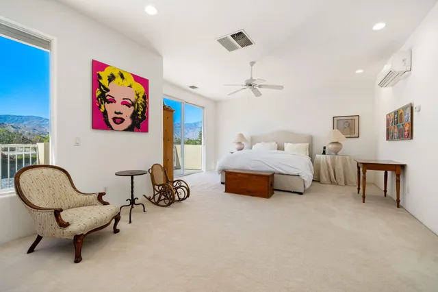 a view of a house with backyard sitting area and swimming pool