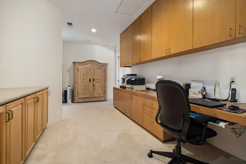 a view of a patio with a table chairs and a backyard
