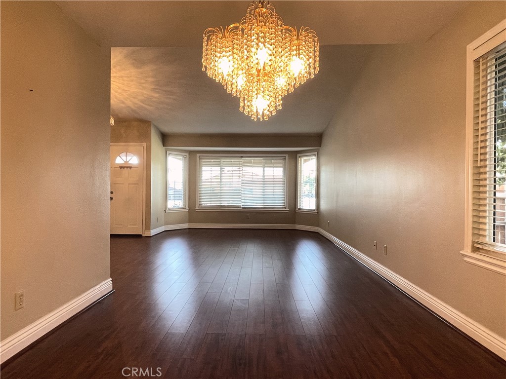 20665 Fuero Drive Walnut, CA 91789 - Photo 11 of 47 an empty room with wooden floor and windows