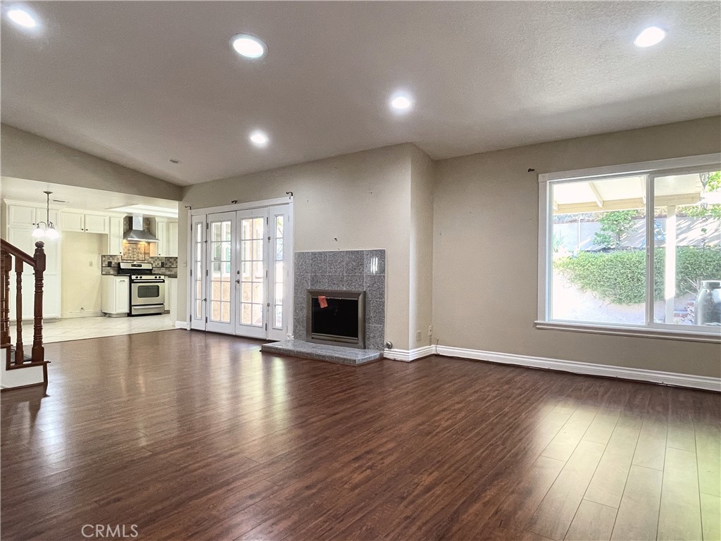 20665 Fuero Drive Walnut, CA 91789 - Photo 19 of 47 an empty room with wooden floor and a fireplace