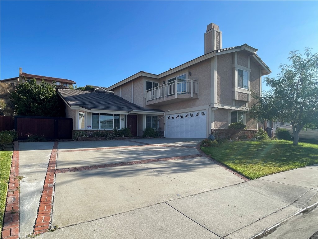 20665 Fuero Drive Walnut, CA 91789 - Photo 2 of 47 a front view of a house with a yard