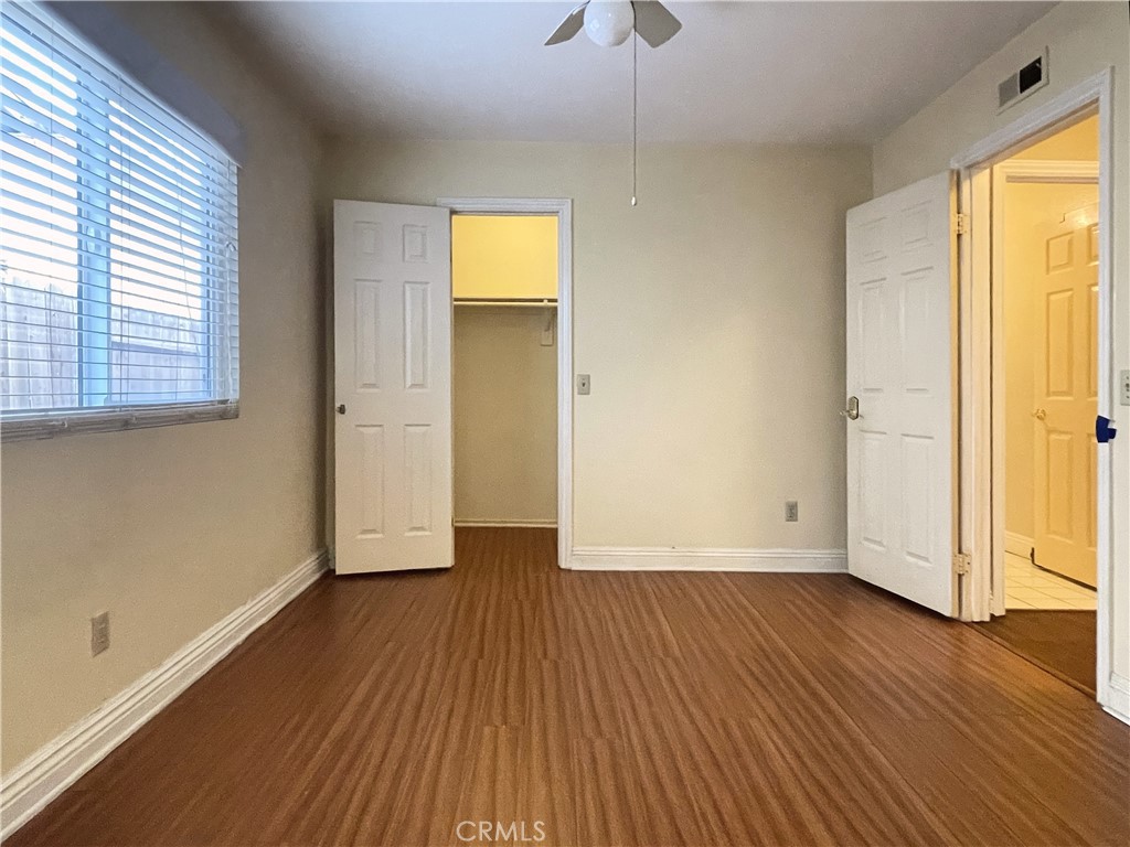 20665 Fuero Drive Walnut, CA 91789 - Photo 28 of 47 an empty room with wooden floor and windows