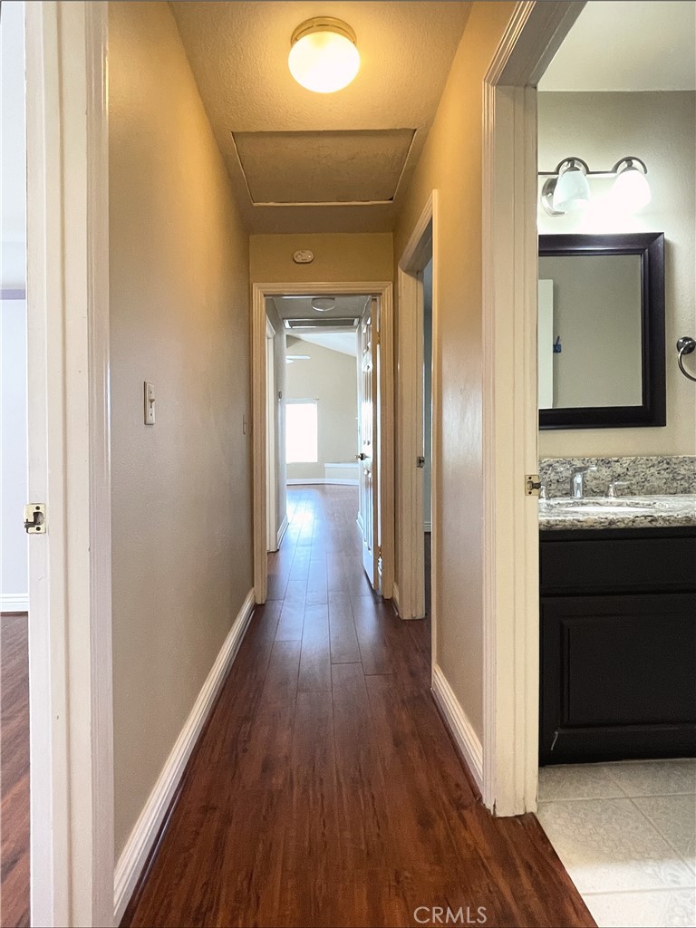 20665 Fuero Drive Walnut, CA 91789 - Photo 34 of 47 a view of a hallway with wooden floor and staircase