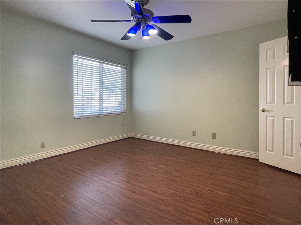 20665 Fuero Drive Walnut, CA 91789 - Photo 38 of 47 an empty room with wooden floor closet chandelier fan and windows