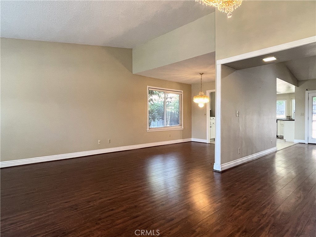 20665 Fuero Drive Walnut, CA 91789 - Photo 4 of 47 an empty room with wooden floor and windows