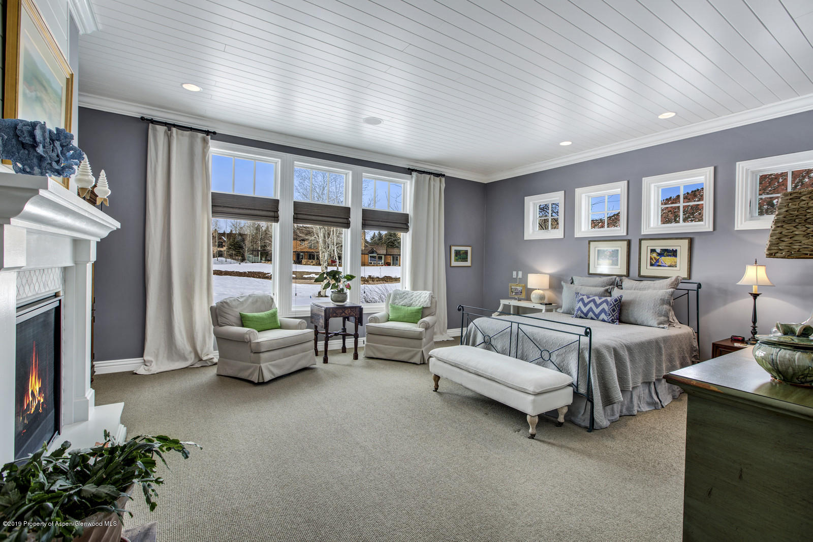 87 Diamond A Ranch Road Carbondale, CO 81623 - Photo 18 of 50 a spacious bedroom with a bed and a couch