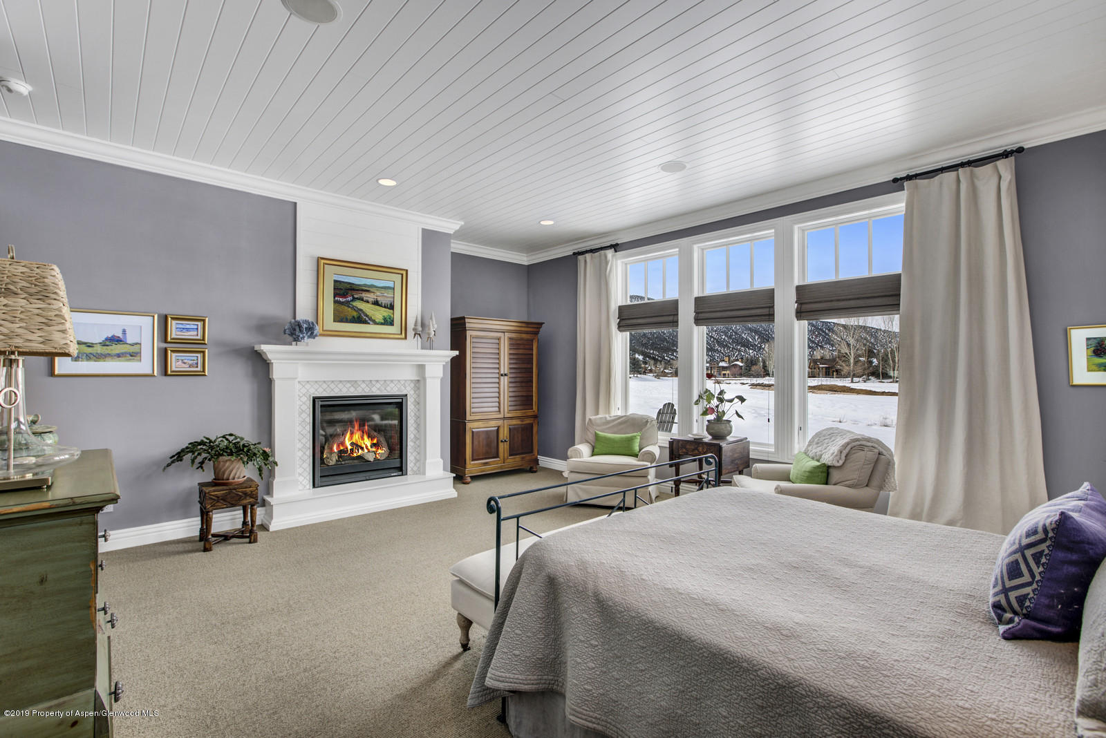 87 Diamond A Ranch Road Carbondale, CO 81623 - Photo 19 of 50 a bed room with a bed and a fireplace