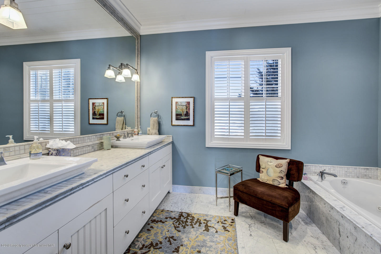 87 Diamond A Ranch Road Carbondale, CO 81623 - Photo 21 of 50 a spacious bathroom with a window double vanity and a mirror