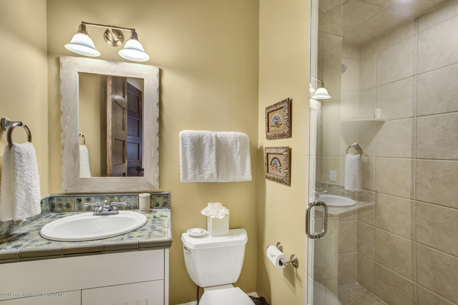 87 Diamond A Ranch Road Carbondale, CO 81623 - Photo 26 of 50 a bathroom with a toilet sink and mirror
