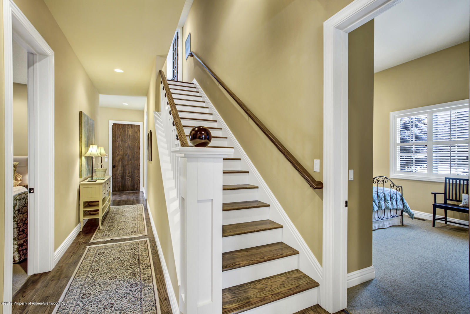87 Diamond A Ranch Road Carbondale, CO 81623 - Photo 27 of 50 a view of a hallway with wooden floor and staircase