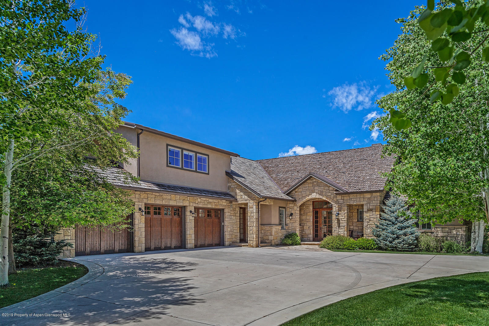 87 Diamond A Ranch Road Carbondale, CO 81623 - Photo 38 of 50 a front view of a house with a yard and potted plants