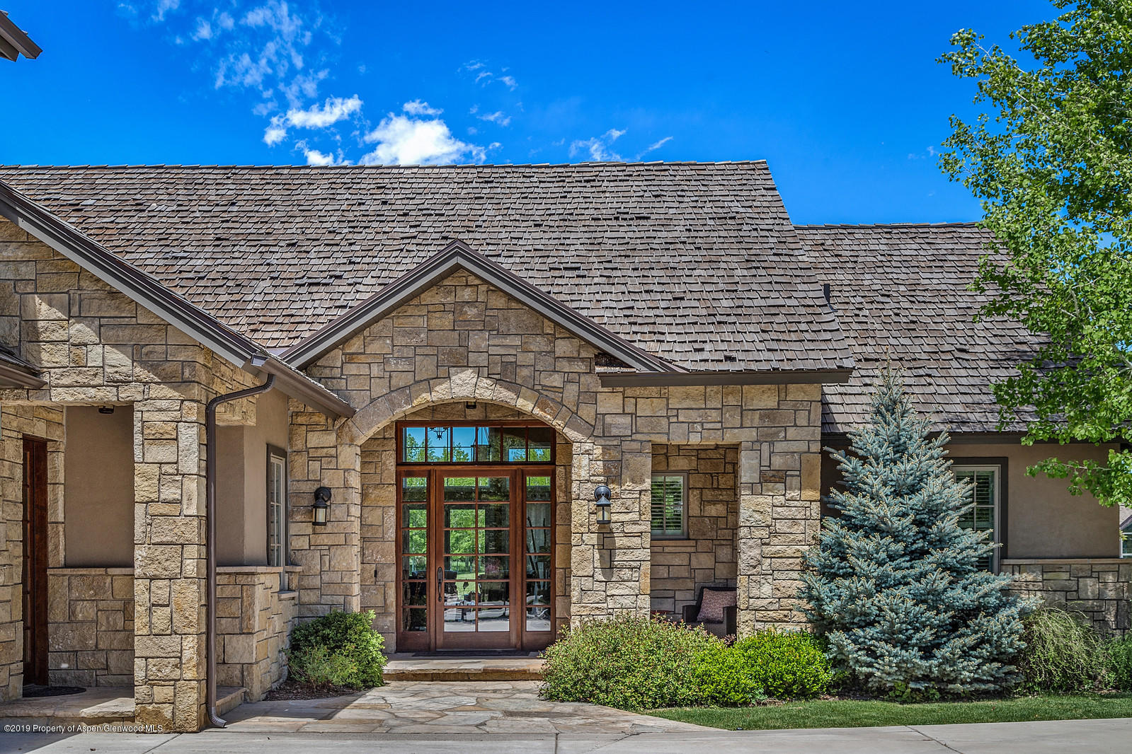 87 Diamond A Ranch Road Carbondale, CO 81623 - Photo 50 of 50 a view of a brick house with potted plants