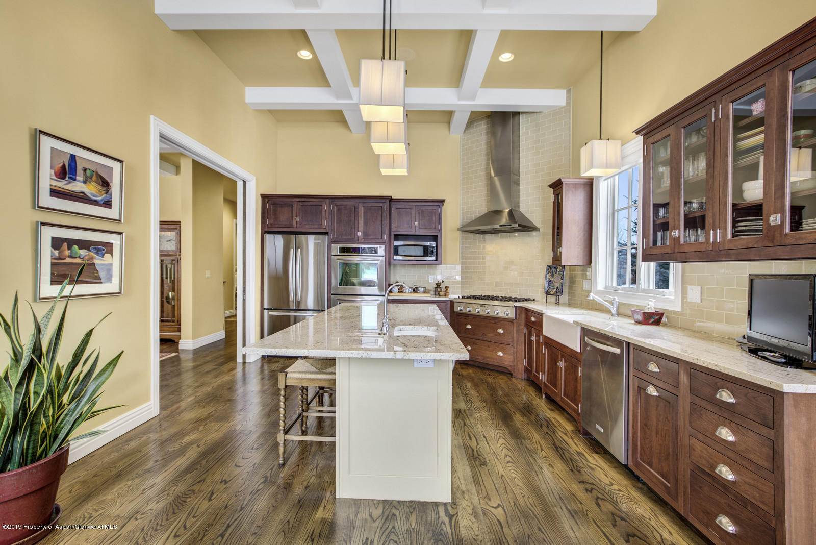 87 Diamond A Ranch Road Carbondale, CO 81623 - Photo 9 of 50 a living room with stainless steel appliances kitchen island granite countertop wooden floor and cabinets