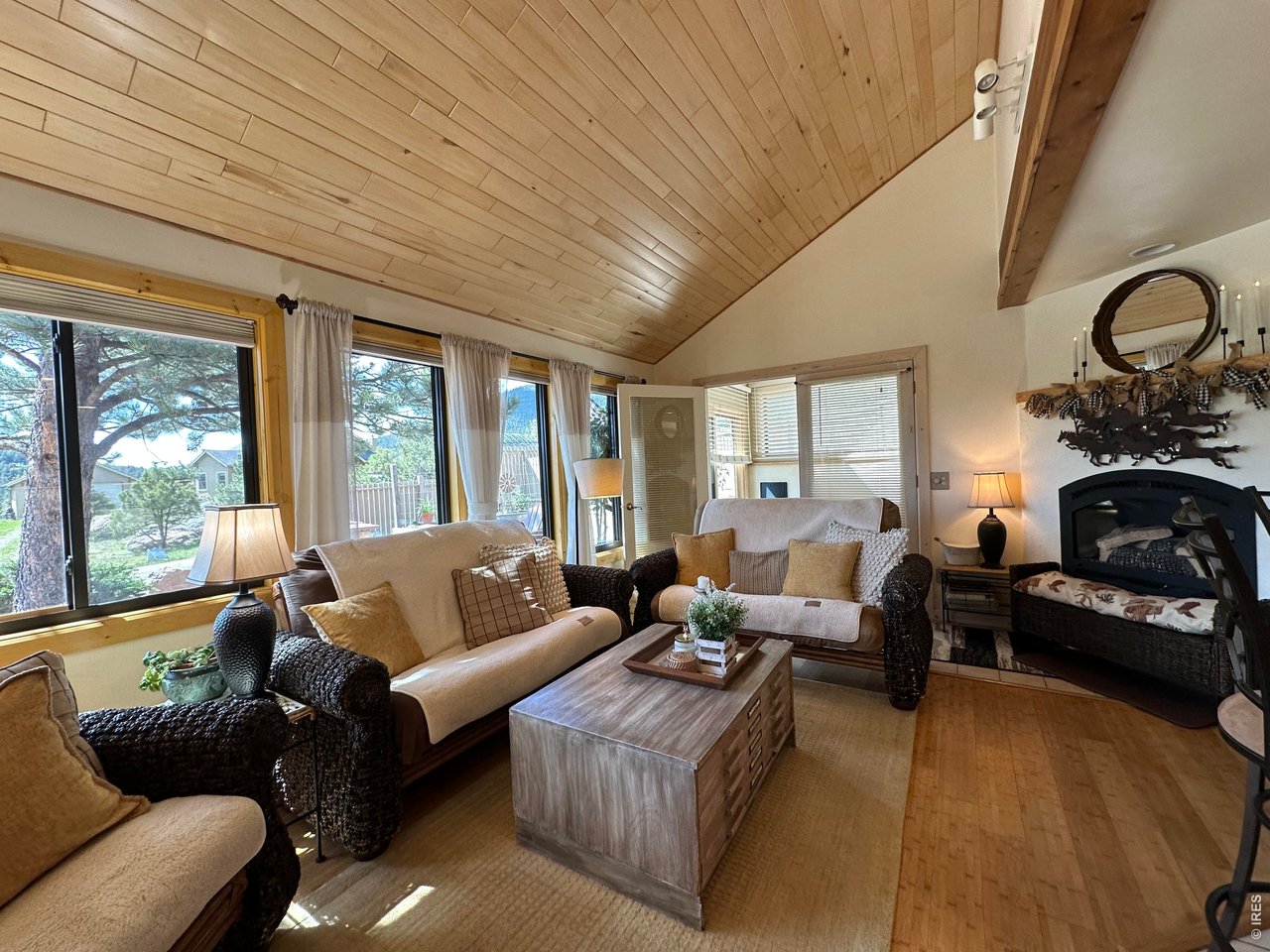 123 Mohawk Road Lyons, CO 80540 - Photo 3 of 35 a living room with furniture large windows and wooden floor