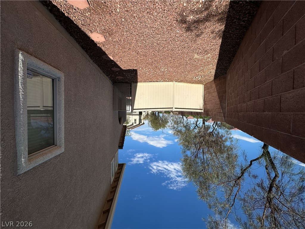 7305 Prussian Green Street Las Vegas, NV 89139 - Photo 19 of 23 A private side yard with gravel ground cover offers a secluded outdoor retreat.