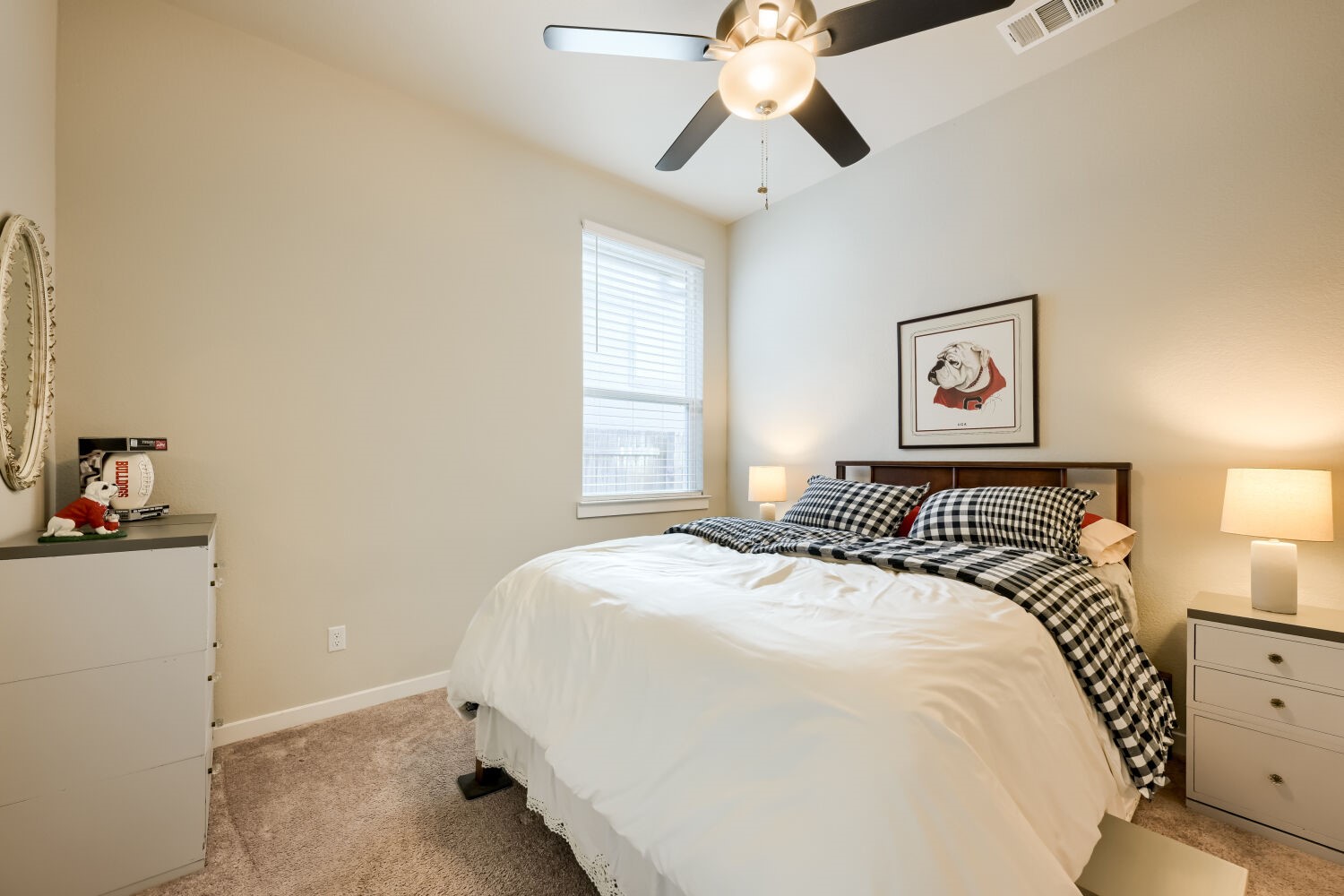 621 Rancho Sienna Loop Georgetown, TX 78628 - Photo 18 of 28 A restful bedroom offers a cozy sleeping area, tall ceilings, and a ceiling fan for comfort.