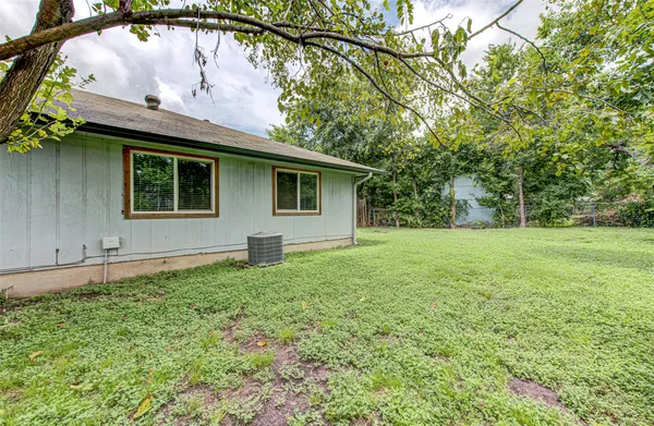 a backyard of a house with lots of green space