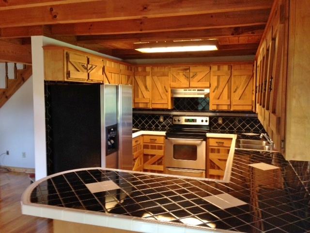 3545 3 Island Road Walling, TN 38587 - Photo 11 of 26 Kitchen is open to dining area and living area.