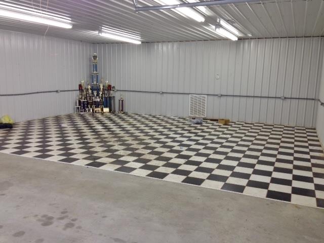 3545 3 Island Road Walling, TN 38587 - Photo 24 of 26 Inside detached garage with black and white ceramic tiles for showroom quality