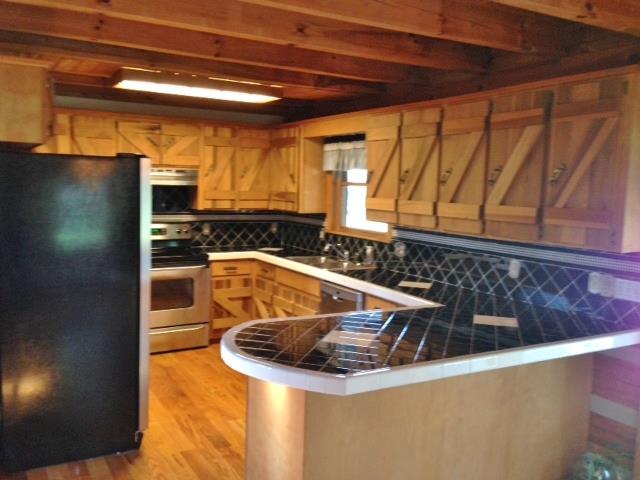 3545 3 Island Road Walling, TN 38587 - Photo 10 of 26 Open kitchen with stainless steel appliances
