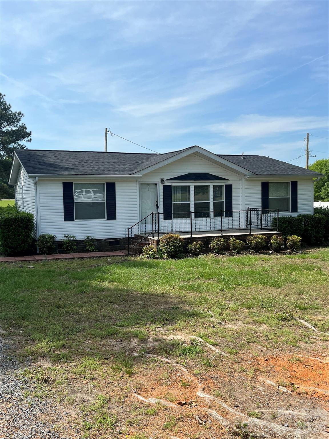 28616 Canton Road Albemarle, NC 28001 - Photo 1 of 31 a front view of a house with a yard