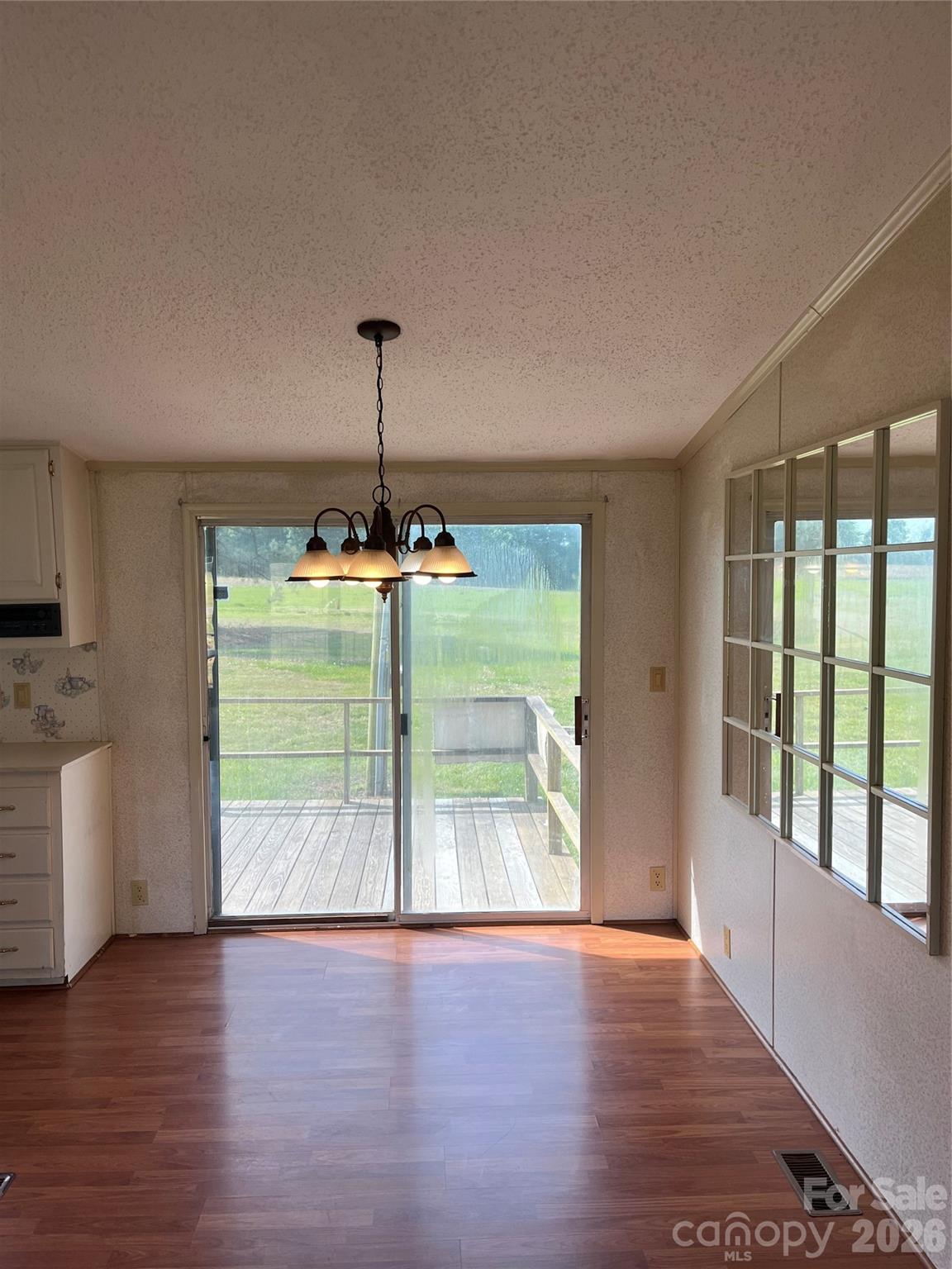 28616 Canton Road Albemarle, NC 28001 - Photo 18 of 31 a room with window and wooden floor