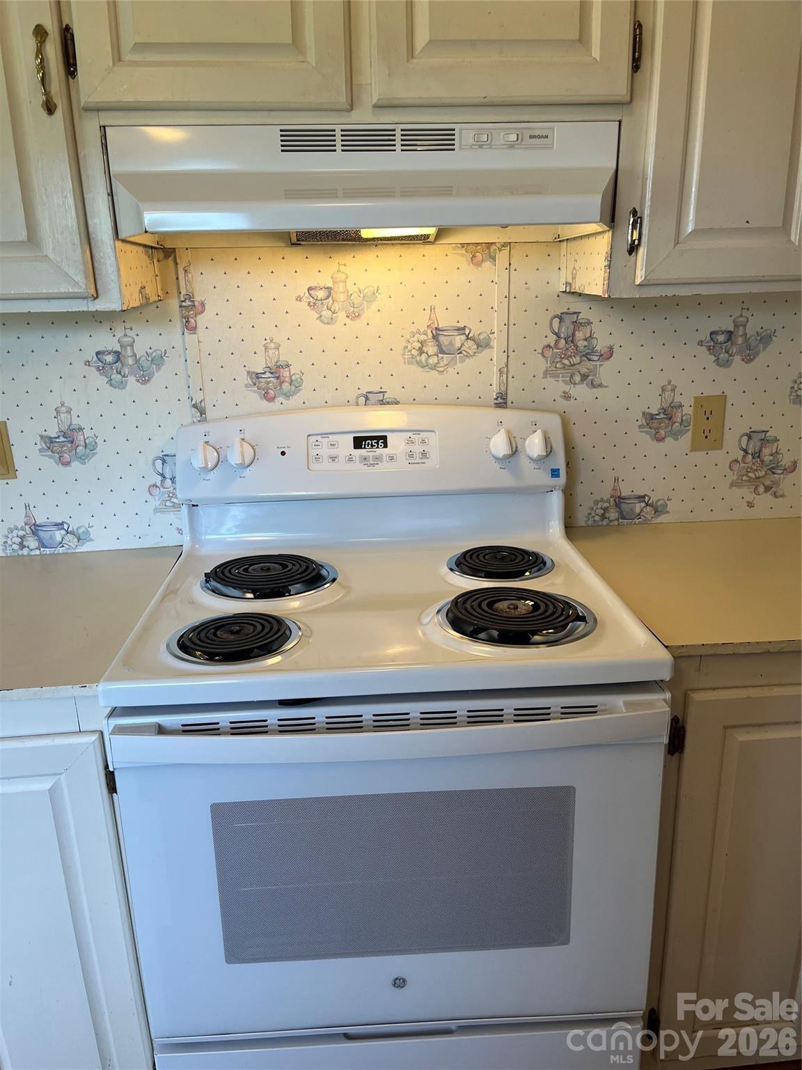 28616 Canton Road Albemarle, NC 28001 - Photo 22 of 31 a stove top oven sitting inside of a kitchen